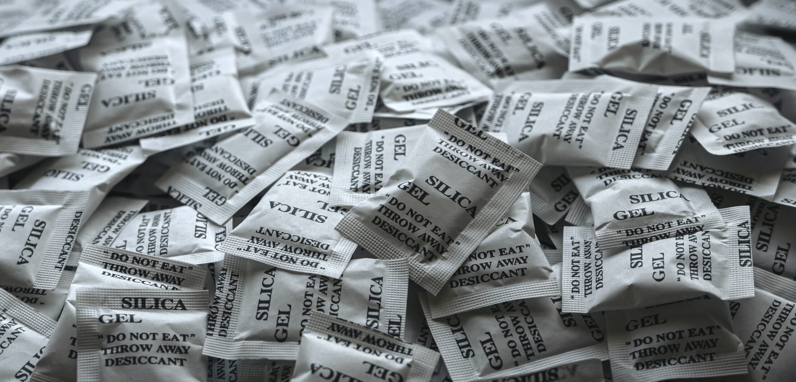 a-bunch-of-desiccant-or-silica-gel-in-white-paper